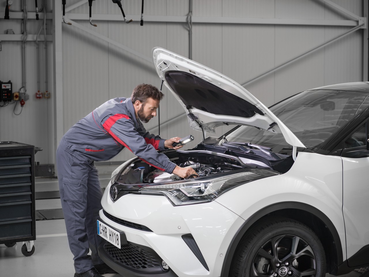 Man inspecting Toyota engine